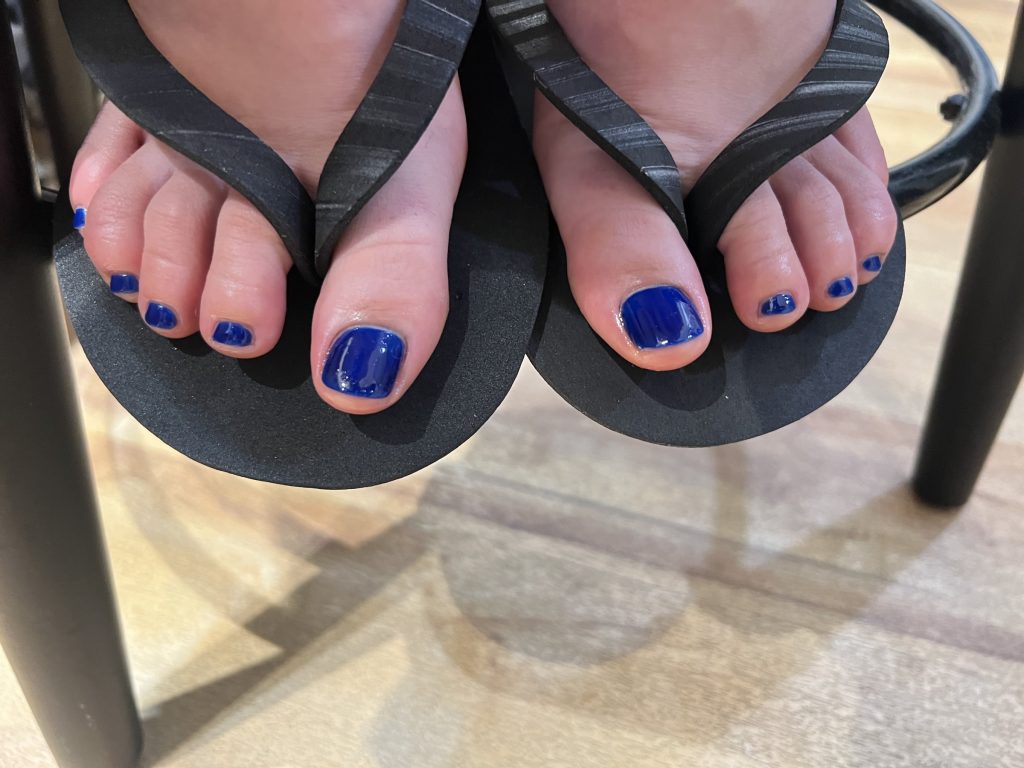 Toenails painted cobalt blue