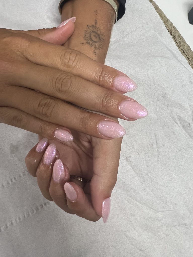 Shimmering pale pink almond nails